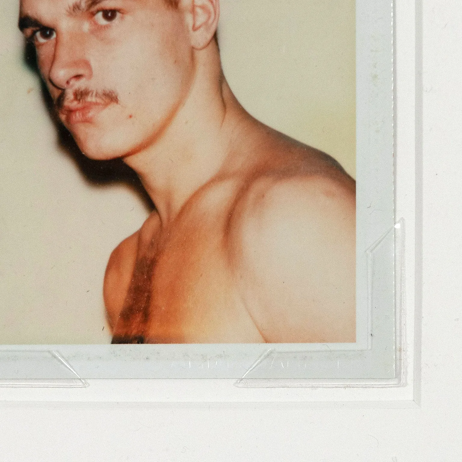 ANDY WARHOL "YOUNG MOUSTACHE" POLAROID, 1977