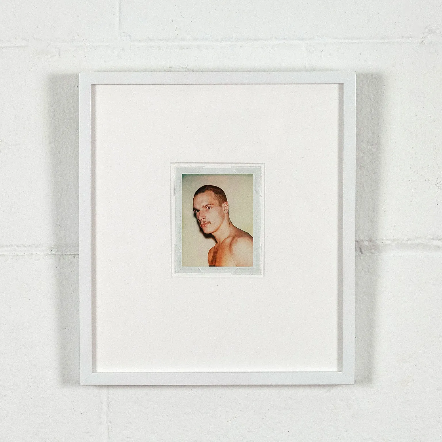 ANDY WARHOL "YOUNG MOUSTACHE" POLAROID, 1977