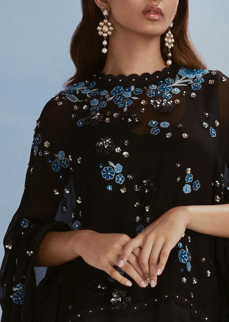 Black cape and draped skirt set